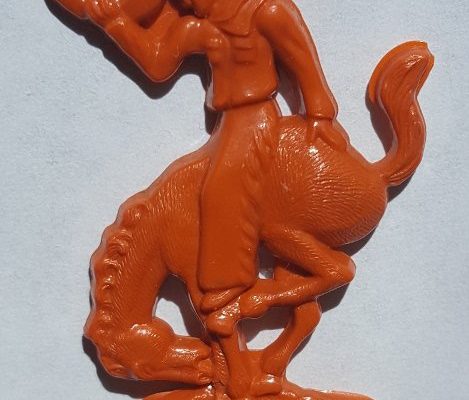 Westerner swizzle stick orange cowboy on horse